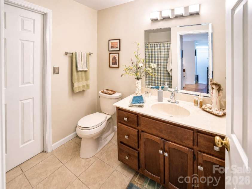 2231 Point Drive, Nebo, NC 28761.  MLS# CAR4428841, YatesRealty ID 53439. Full guest bath main level door to laundry