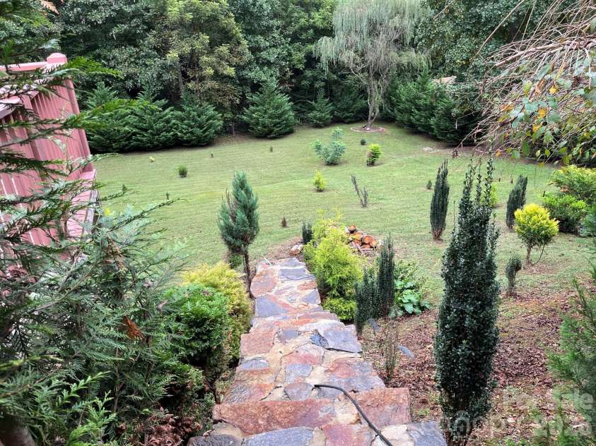254 Jupiter Road, Weaverville, NC 28787.  MLS# CAR4425895, YatesRealty ID 53446. Rock steps leading to huge back yard