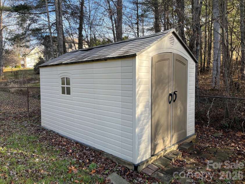 254 Jupiter Road, Weaverville, NC 28787.  MLS# CAR4425895, YatesRealty ID 53446. Shed in back yard