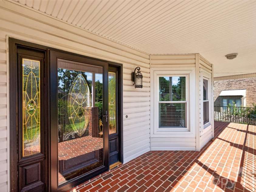 1058 13th Avenue Place, Hickory, NC 28601.  MLS# CAR4429107, YatesRealty ID 53463. Front porch Entrance