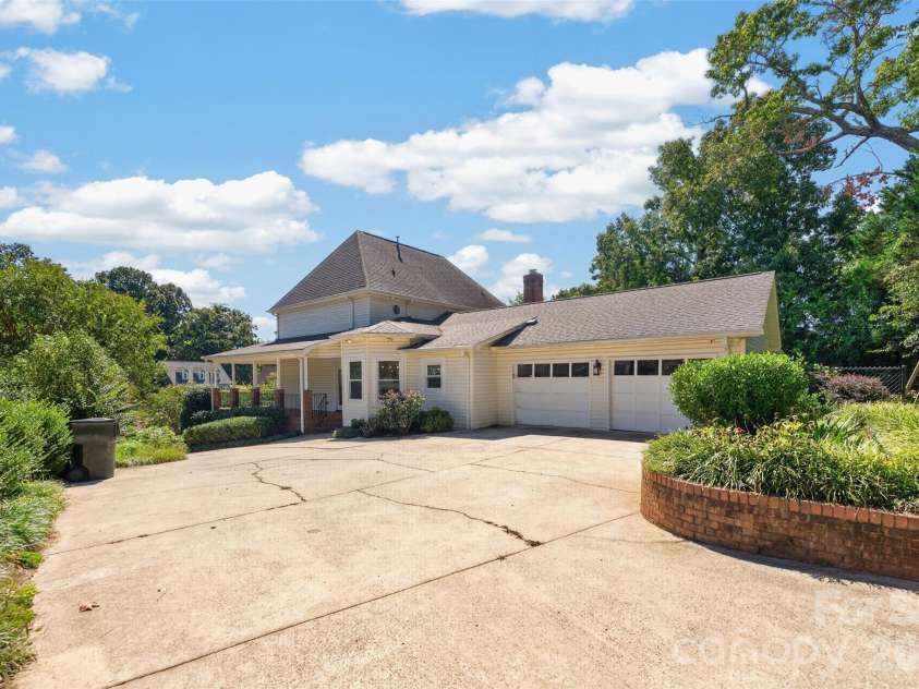 1058 13th Avenue Place, Hickory, NC 28601.  MLS# CAR4429107, YatesRealty ID 53463. Side of home