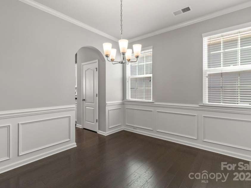 2031 Killian Creek Drive, Denver, NC 28037.  MLS# CAR4241758, YatesRealty ID 5349. Crown, chair rail and picture frame moldings accentuate this space