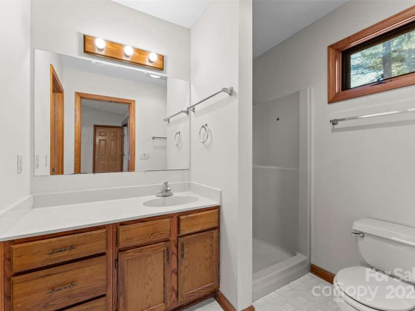 550 Kinross Drive, Flat Rock, NC 28731.  MLS# CAR4215035, YatesRealty ID 535. Full bathroom w walk in shower