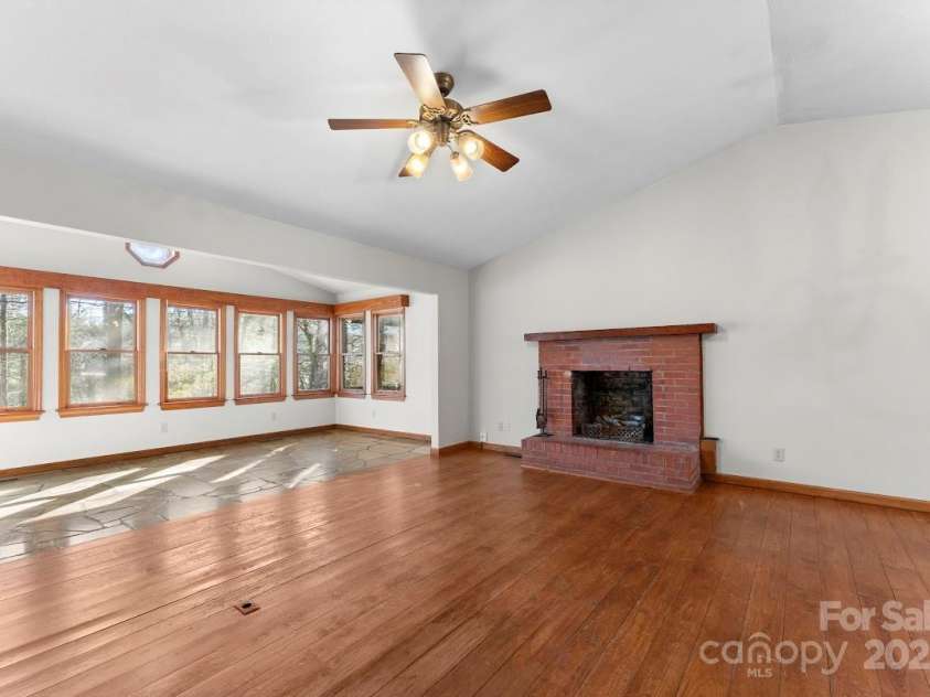 550 Kinross Drive, Flat Rock, NC 28731.  MLS# CAR4215035, YatesRealty ID 535. Great room with hardwood floors