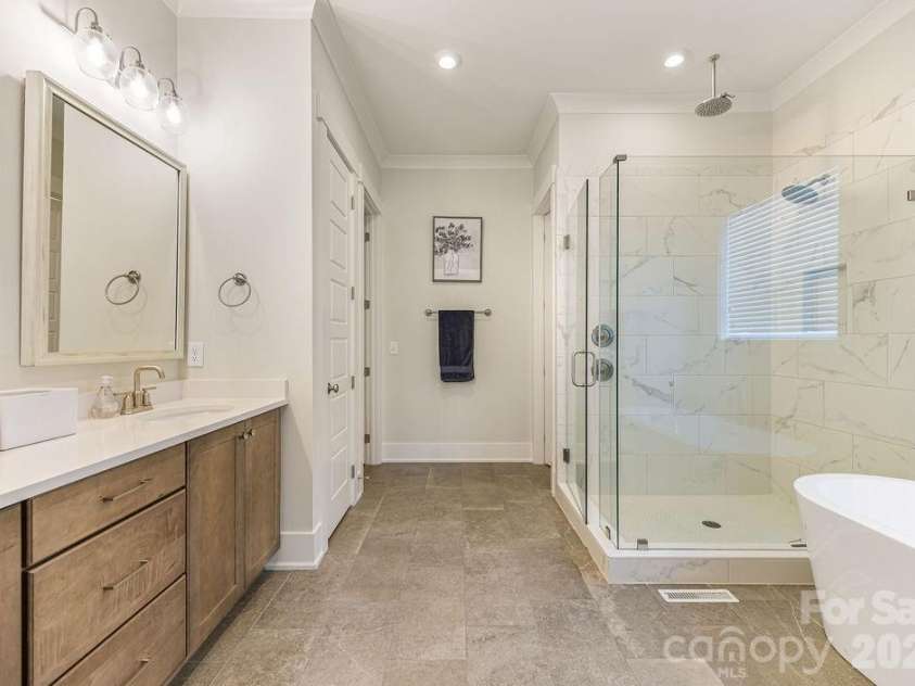 16 Bally Bunion Lane, Pinehurst, NC 28374.  MLS# CAR4429084, YatesRealty ID 53503. Double Sinks and Large shower with multiple Shower heads