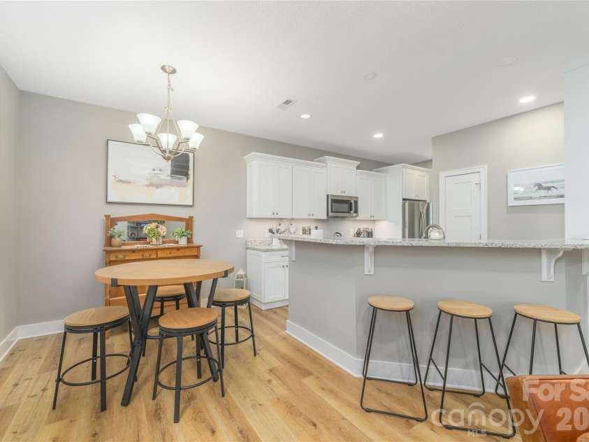 31 Burlington Lane, Fletcher, NC 28732.  MLS# CAR4428063, YatesRealty ID 53513. Granite counters with breakfast bar