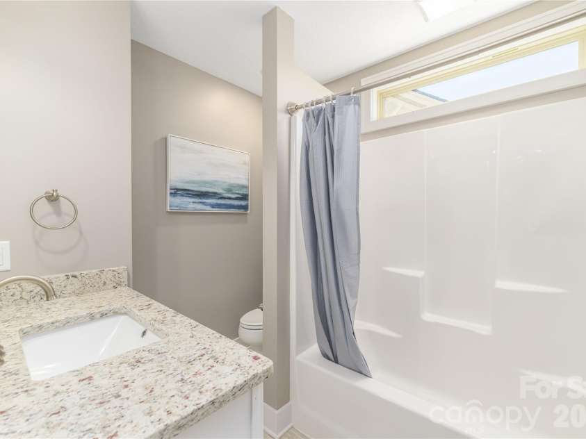 31 Burlington Lane, Fletcher, NC 28732.  MLS# CAR4428063, YatesRealty ID 53513. Guest bath with custom windows above
