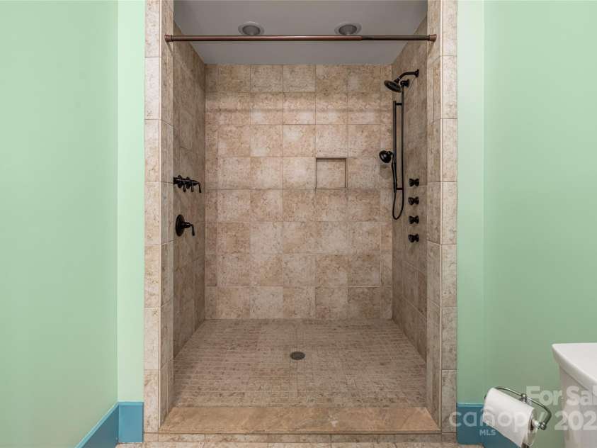635 Whisper Mountain Drive, Leicester, NC 28748.  MLS# CAR4302796, YatesRealty ID 5352. Full Bath with tile shower in lower level guest suite