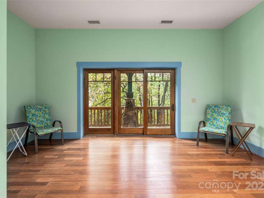 635 Whisper Mountain Drive, Leicester, NC 28748.  MLS# CAR4302796, YatesRealty ID 5352. Lower level flex space + guest quarters = multi-gen, STR, or retreat rental potential