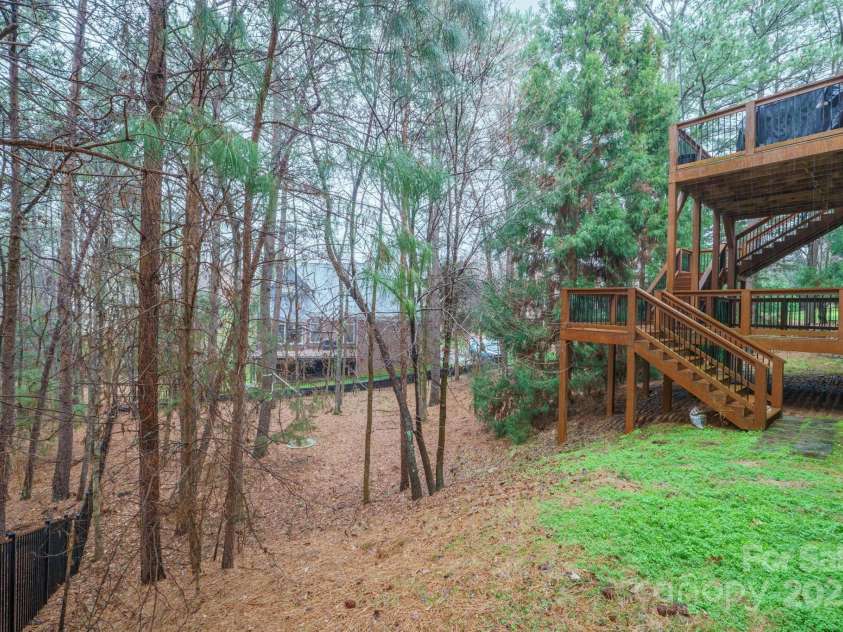 722 Fairway Point Drive, Fort Mill, SC 29708.  MLS# CAR4232494, YatesRealty ID 5353. Expansive Fenced and wooded backyard