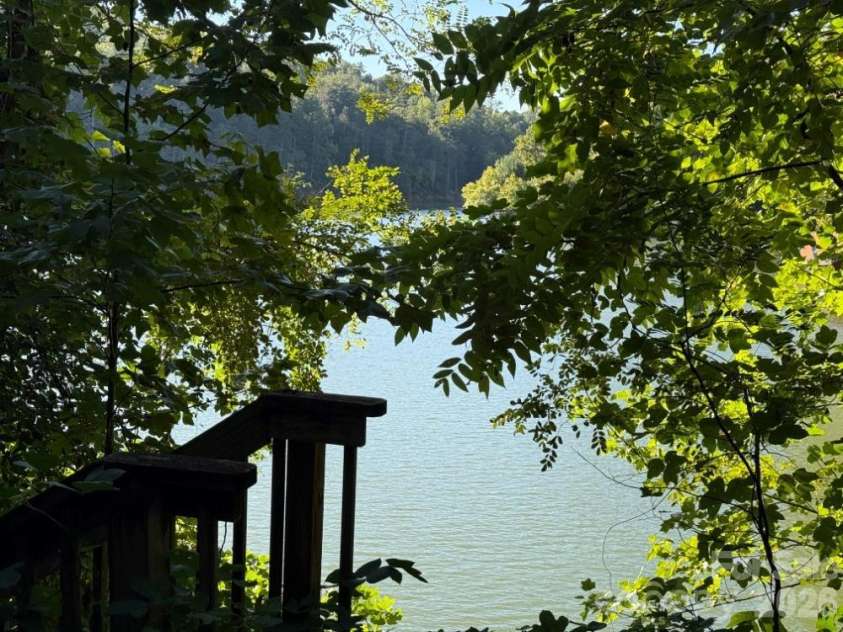 144 Conroy Court, Lake Lure, NC 28746.  MLS# CAR4428368, YatesRealty ID 53548. Overlooking Open Water