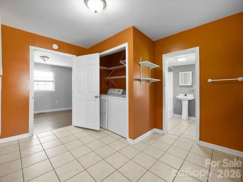 24 Forest Hill Road, Lexington, NC 27295.  MLS# CAR4427630, YatesRealty ID 53572. Laundry closet in kitchen
