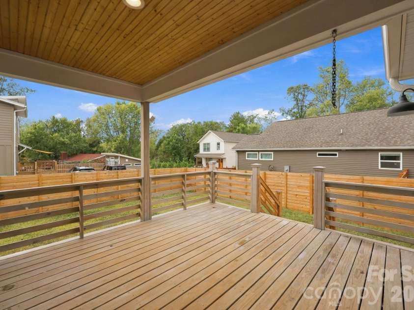 34 Gudger Road, Candler, NC 28715.  MLS# CAR4426999, YatesRealty ID 53579. Covered Back Porch