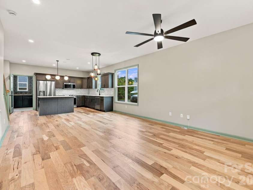 34 Gudger Road, Candler, NC 28715.  MLS# CAR4426999, YatesRealty ID 53579. Hickory engineered wood flooring, open design