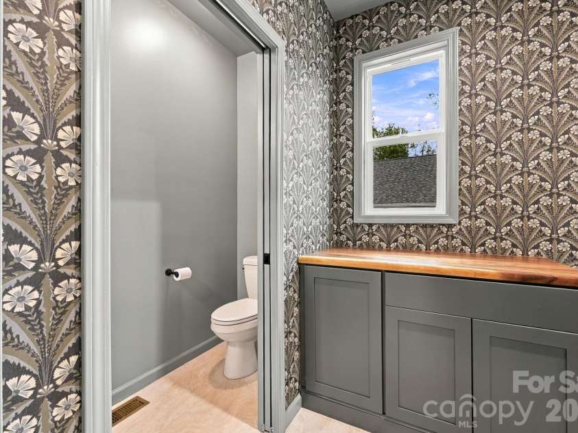 34 Gudger Road, Candler, NC 28715.  MLS# CAR4426999, YatesRealty ID 53579. Mud room and half bath