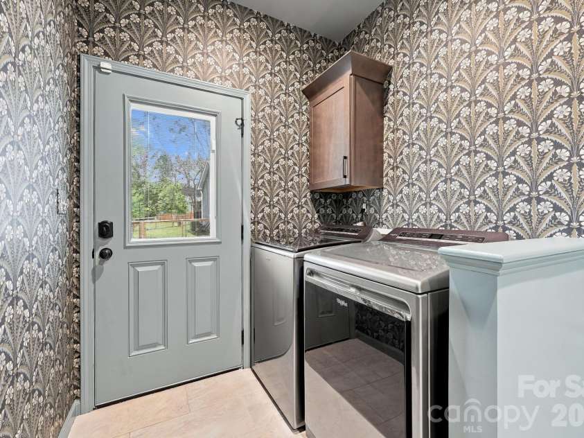 34 Gudger Road, Candler, NC 28715.  MLS# CAR4426999, YatesRealty ID 53579. Mud room laundry area