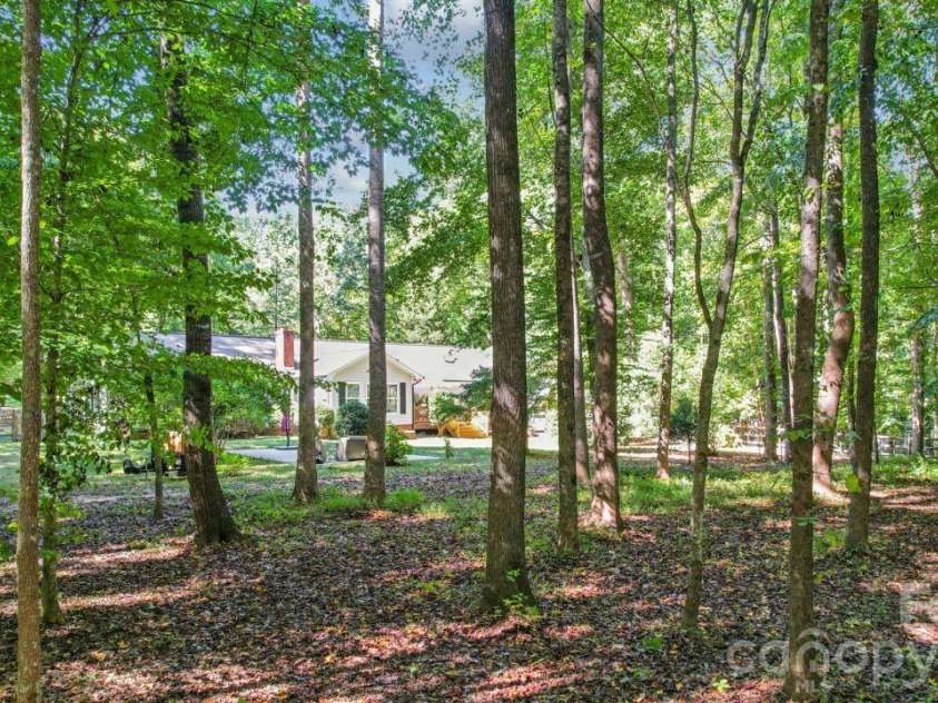 5919 Stonebridge Lane, Waxhaw, NC 28173.  MLS# CAR4427781, YatesRealty ID 53580. Large 2.1 acre private backyard with trees