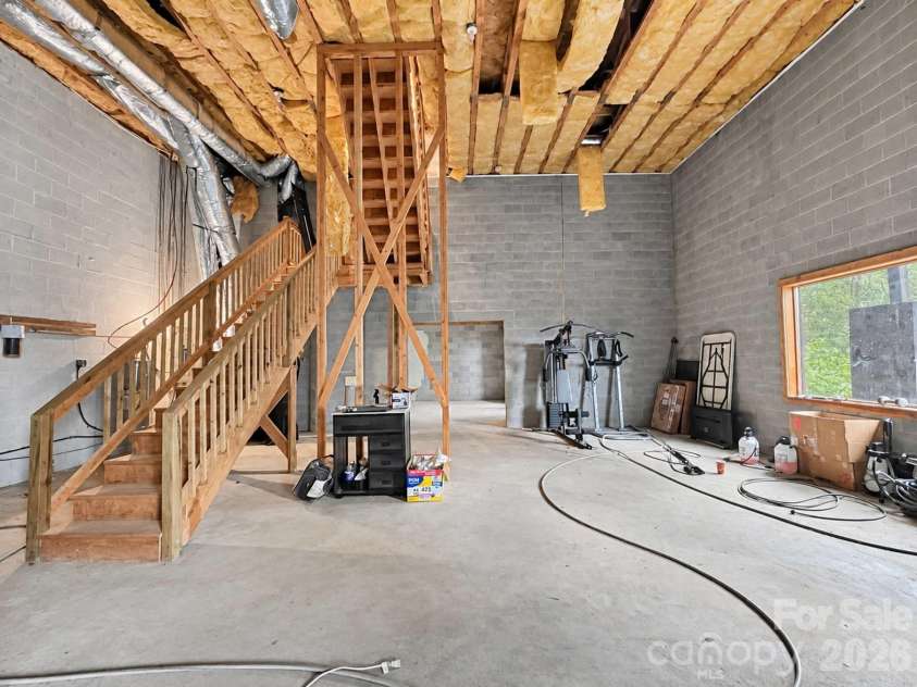 240 Fortner Avenue, Bryson City, NC 28713.  MLS# CAR4429372, YatesRealty ID 53587. Unfinished basement MASSIVE Ceilings