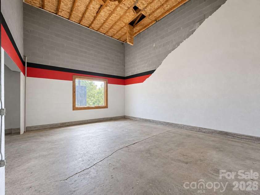 240 Fortner Avenue, Bryson City, NC 28713.  MLS# CAR4429372, YatesRealty ID 53587. Unfinished basement MASSIVE Ceilings