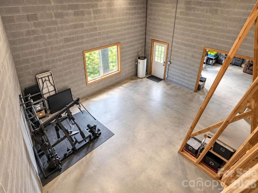 240 Fortner Avenue, Bryson City, NC 28713.  MLS# CAR4429372, YatesRealty ID 53587. Unfinished basement MASSIVE Ceilings
