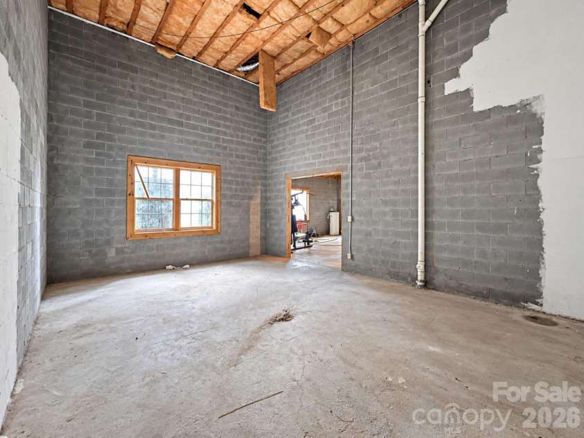 240 Fortner Avenue, Bryson City, NC 28713.  MLS# CAR4429372, YatesRealty ID 53587. Unfinished basement MASSIVE Ceilings