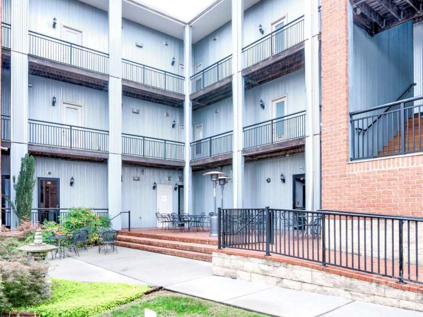 119 Lee Street, Salisbury, NC 28144.  MLS# CAR4216965, YatesRealty ID 536. Ramp is at right. Condo door is center on main floor.