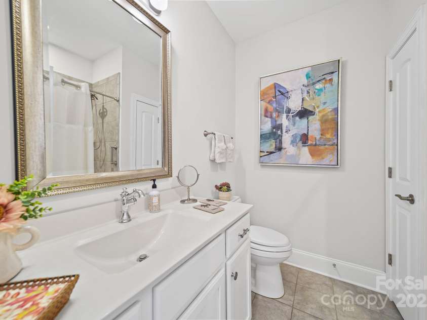 4516 Ideal Way, Harrisburg, NC 28075.  MLS# CAR4325804, YatesRealty ID 536. The Hall Guest Bath Features Custom Tile Floor