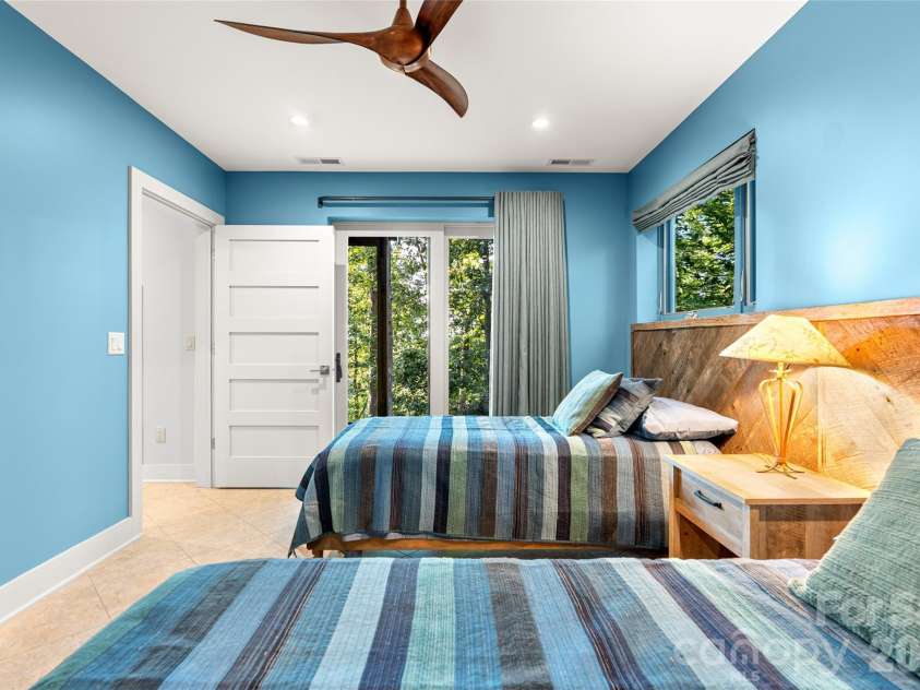 34 Bee Balm Way, Asheville, NC 28804.  MLS# CAR4420482, YatesRealty ID 53633. Lower level bedroom, with sliders to outside.