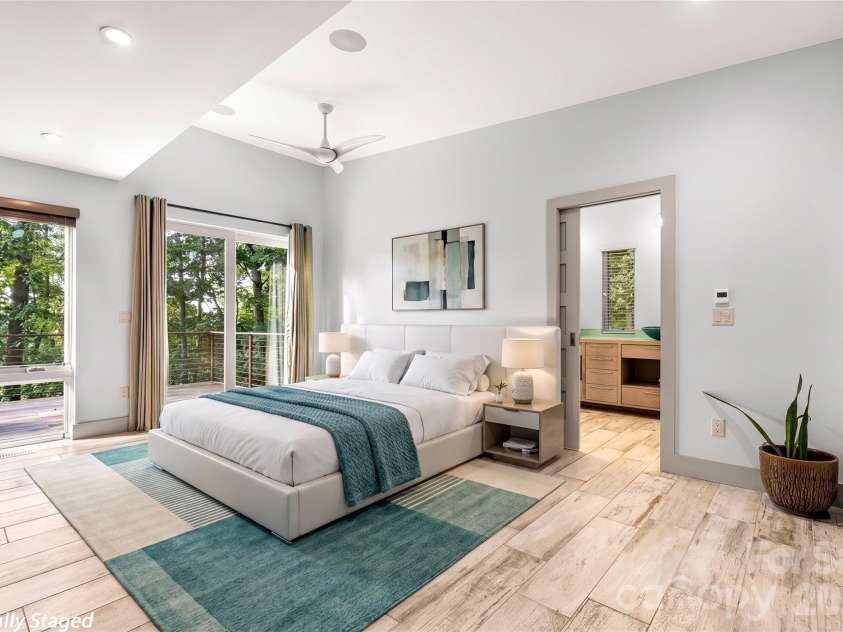 34 Bee Balm Way, Asheville, NC 28804.  MLS# CAR4420482, YatesRealty ID 53633. Main level primary bedroom virtually staged.