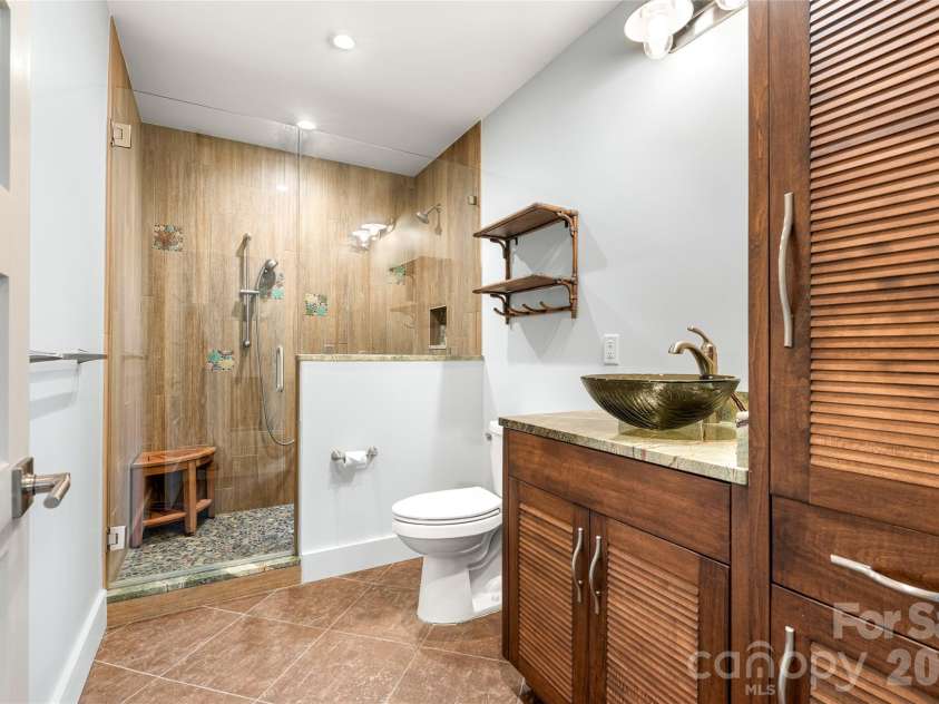 34 Bee Balm Way, Asheville, NC 28804.  MLS# CAR4420482, YatesRealty ID 53633. More custom tile in the basement full bath.