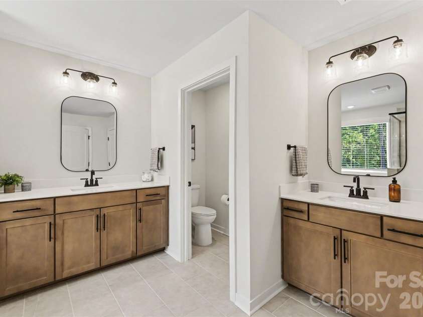 7513 Bainbridge Road, Sherrills Ford, NC 28673.  MLS# CAR4425018, YatesRealty ID 53654. Separate Vanities in the Primary Bathroom