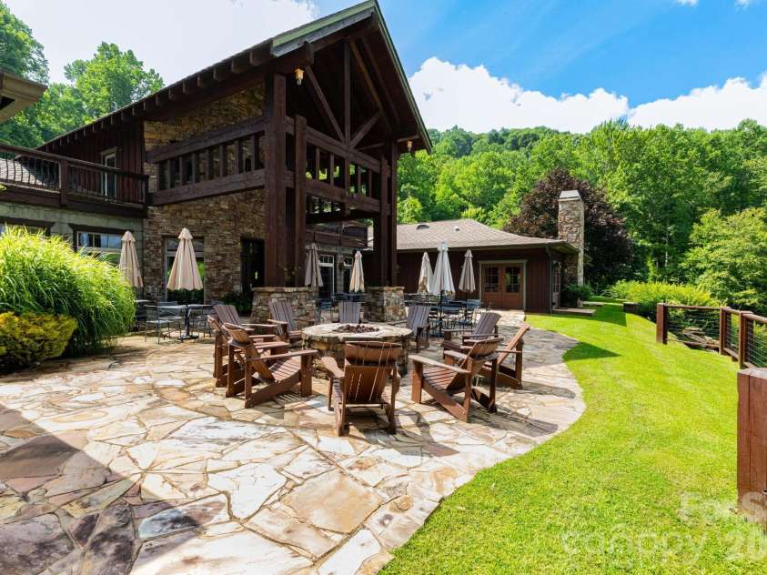30 Finlaystone Trace, Waynesville, NC 28786.  MLS# CAR4425626, YatesRealty ID 53671. Firepit and tables for dining at clubhouse.