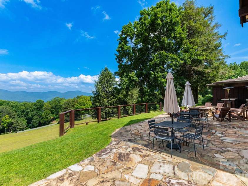30 Finlaystone Trace, Waynesville, NC 28786.  MLS# CAR4425626, YatesRealty ID 53671. Mountain views while dining outside.