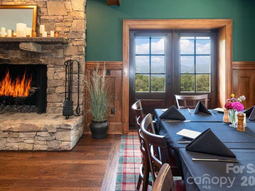 25 Finlaystone Trace, Waynesville, NC 28786.  MLS# CAR4425631, YatesRealty ID 53676. Dining by the fire.