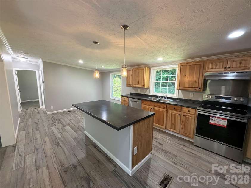 1034 Hidden View Loop, Marion, NC 28752.  MLS# CAR4429503, YatesRealty ID 53677. Kitchen with tile floors