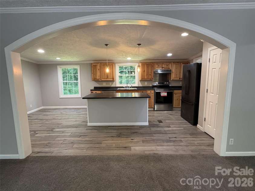 1034 Hidden View Loop, Marion, NC 28752.  MLS# CAR4429503, YatesRealty ID 53677. Living Room looking into kitchen