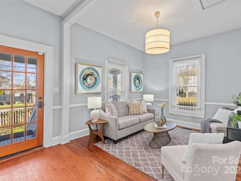 701 Torrence Street, Charlotte, NC 28204.  MLS# CAR4225479, YatesRealty ID 5368. Living room with hardwood floors, high ceilings and ample natural light.