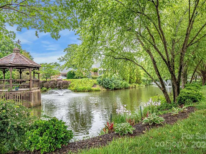 11406 Olde Turnbury Court, Charlotte, NC 28277.  MLS# CAR4233679, YatesRealty ID 5369. Community Pond and landscaped grounds with four seasons of plantings.