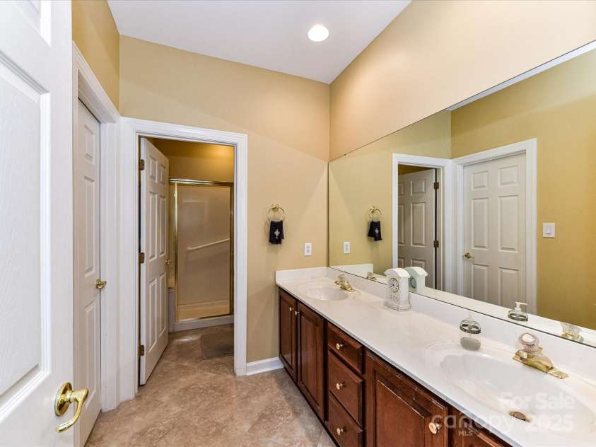 11406 Olde Turnbury Court, Charlotte, NC 28277.  MLS# CAR4233679, YatesRealty ID 5369. Dual sinks and tile floor.