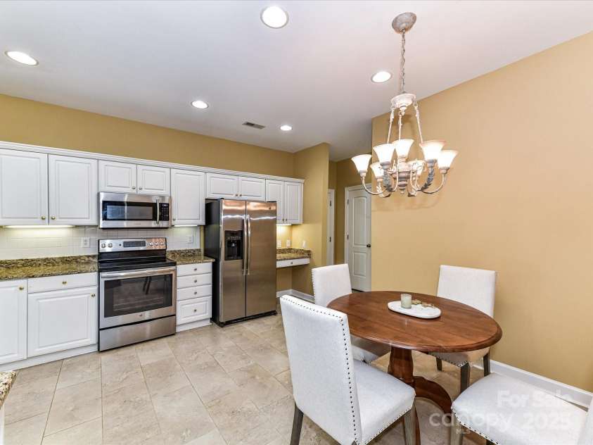 11406 Olde Turnbury Court, Charlotte, NC 28277.  MLS# CAR4233679, YatesRealty ID 5369. Refrigerator does convey and there is a convenient desk area next to the pantry.
