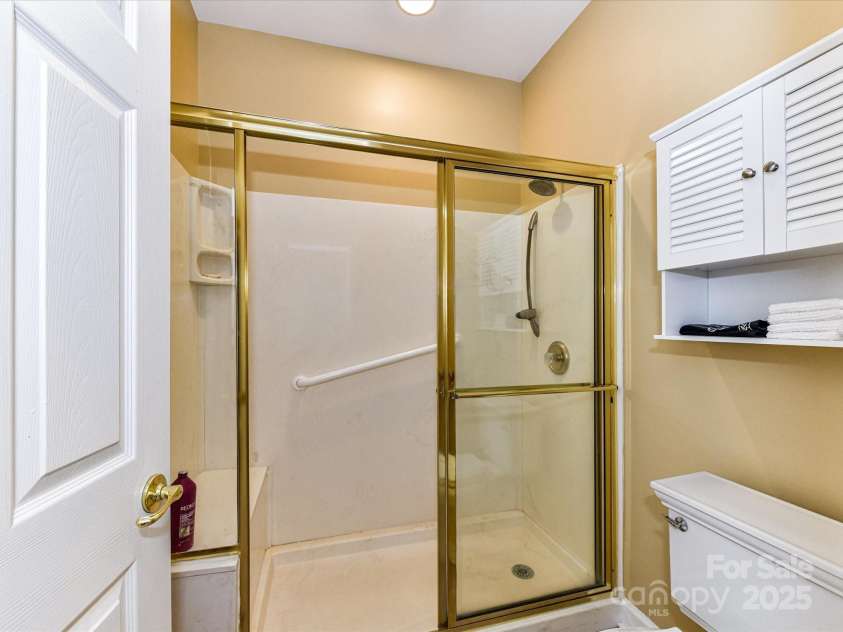 11406 Olde Turnbury Court, Charlotte, NC 28277.  MLS# CAR4233679, YatesRealty ID 5369. Walk-in shower and water closet- both feature safety Grab Bars.