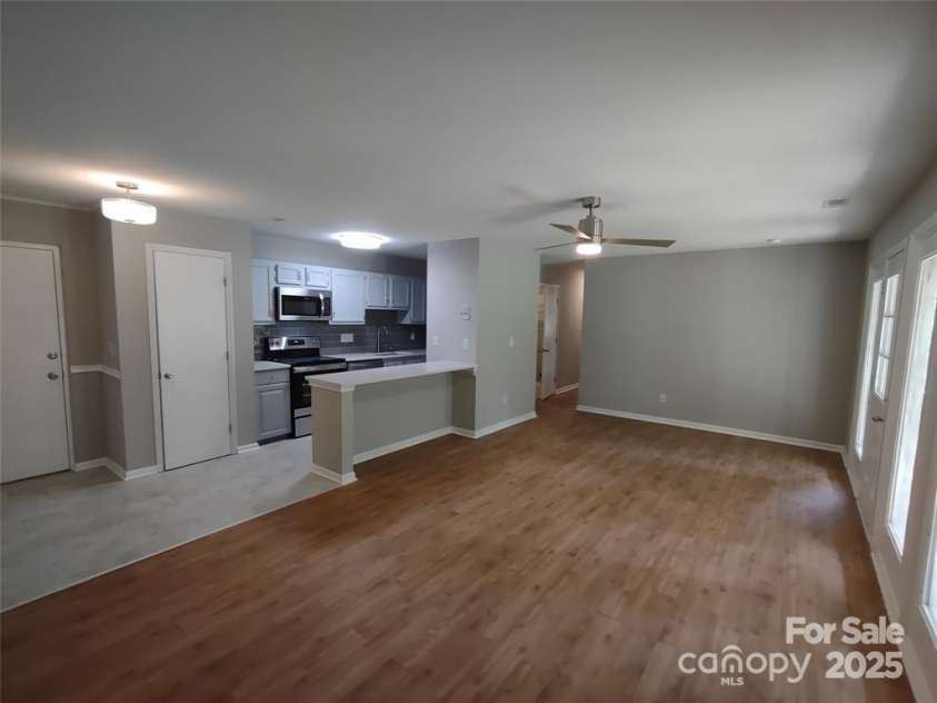 6106 Meadow Rose Lane, Charlotte, NC 28215.  MLS# CAR4217029, YatesRealty ID 537. Living Room into kitchen