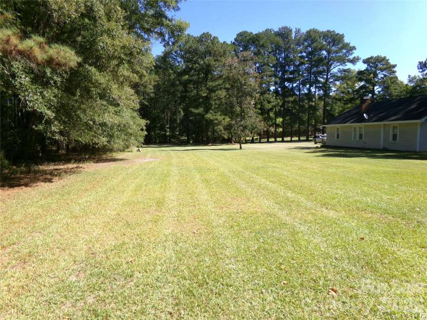 44731 Gold Branch Road, Richfield, NC 28137.  MLS# CAR4428570, YatesRealty ID 53701. Back and side yard