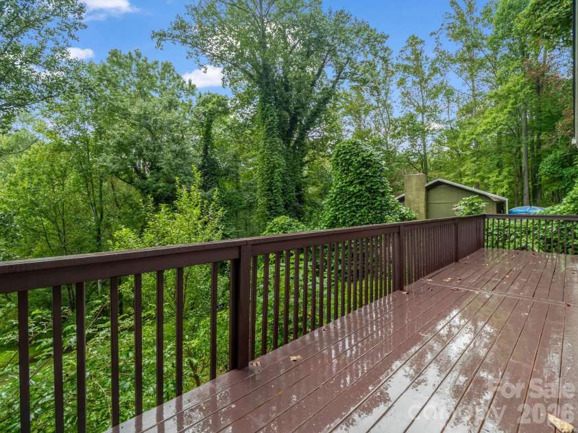 697 Courtney Drive, Hendersonville, NC 28792.  MLS# CAR4429227, YatesRealty ID 53752. Improved HUGE main level deck