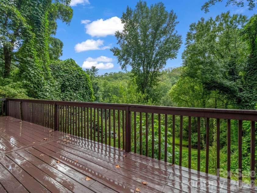697 Courtney Drive, Hendersonville, NC 28792.  MLS# CAR4429227, YatesRealty ID 53752. Improved HUGE main level deck