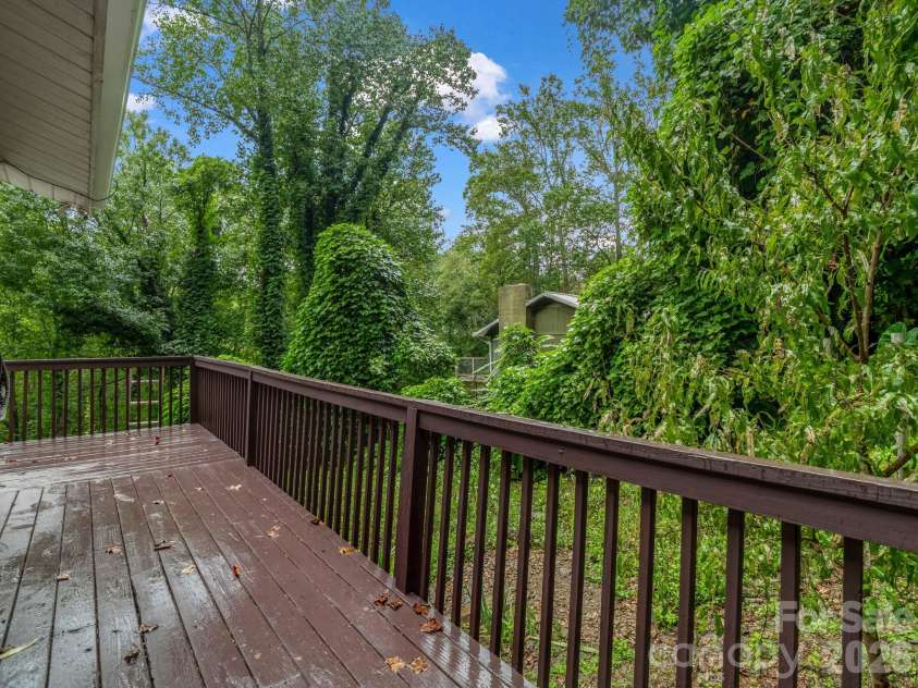 697 Courtney Drive, Hendersonville, NC 28792.  MLS# CAR4429227, YatesRealty ID 53752. Improved HUGE main level deck