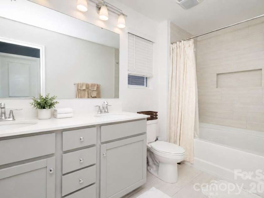 106 Stonewater Drive, Stanfield, NC 28163.  MLS# CAR4422919, YatesRealty ID 53764. Primary full bathroom with dual vanity