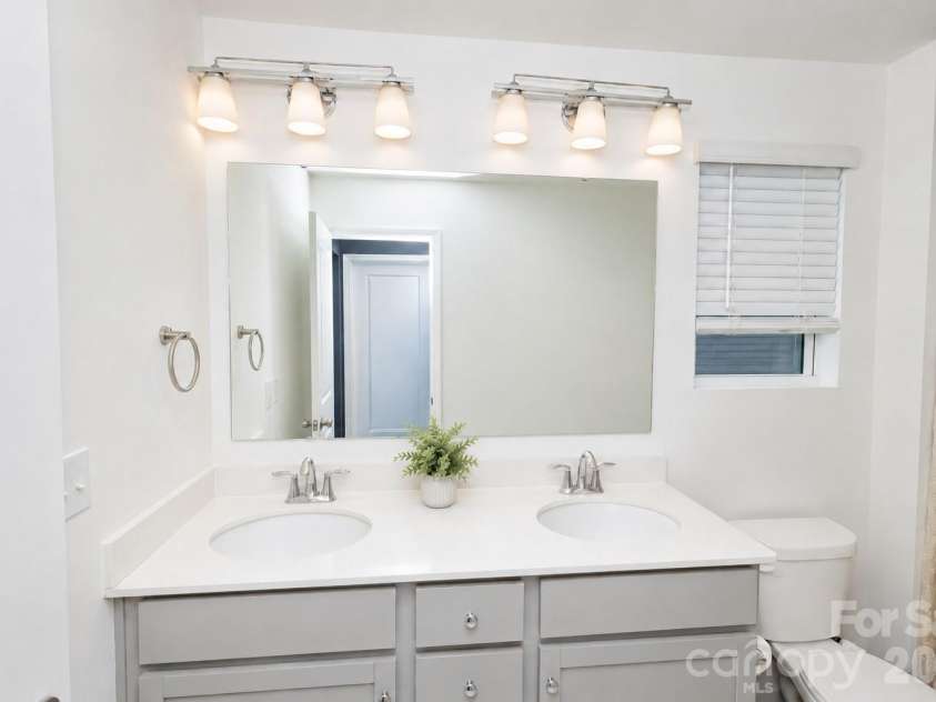 106 Stonewater Drive, Stanfield, NC 28163.  MLS# CAR4422919, YatesRealty ID 53764. Primary full bathroom with dual vanity