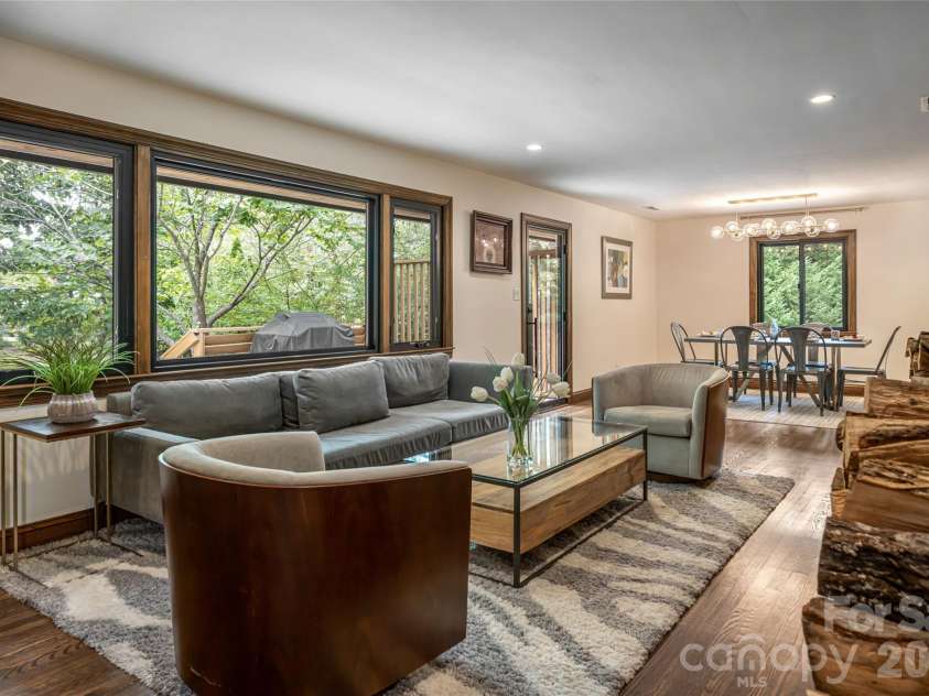 3 Maplewood Parkway, Asheville, NC 28804.  MLS# CAR4425655, YatesRealty ID 53767. Living room flows into dining area and accesses back porch