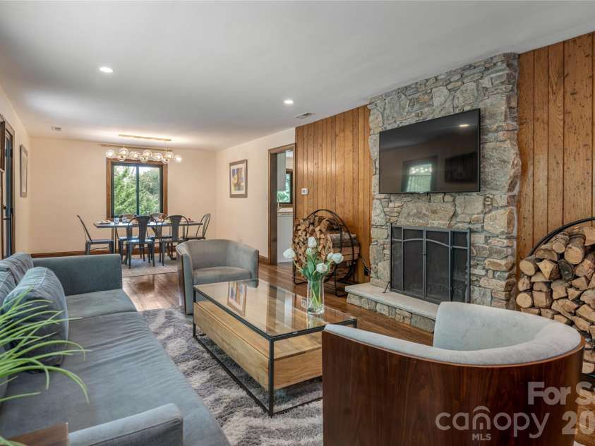 3 Maplewood Parkway, Asheville, NC 28804.  MLS# CAR4425655, YatesRealty ID 53767. Wormy chestnut accent wall.surrounds the fireplace
